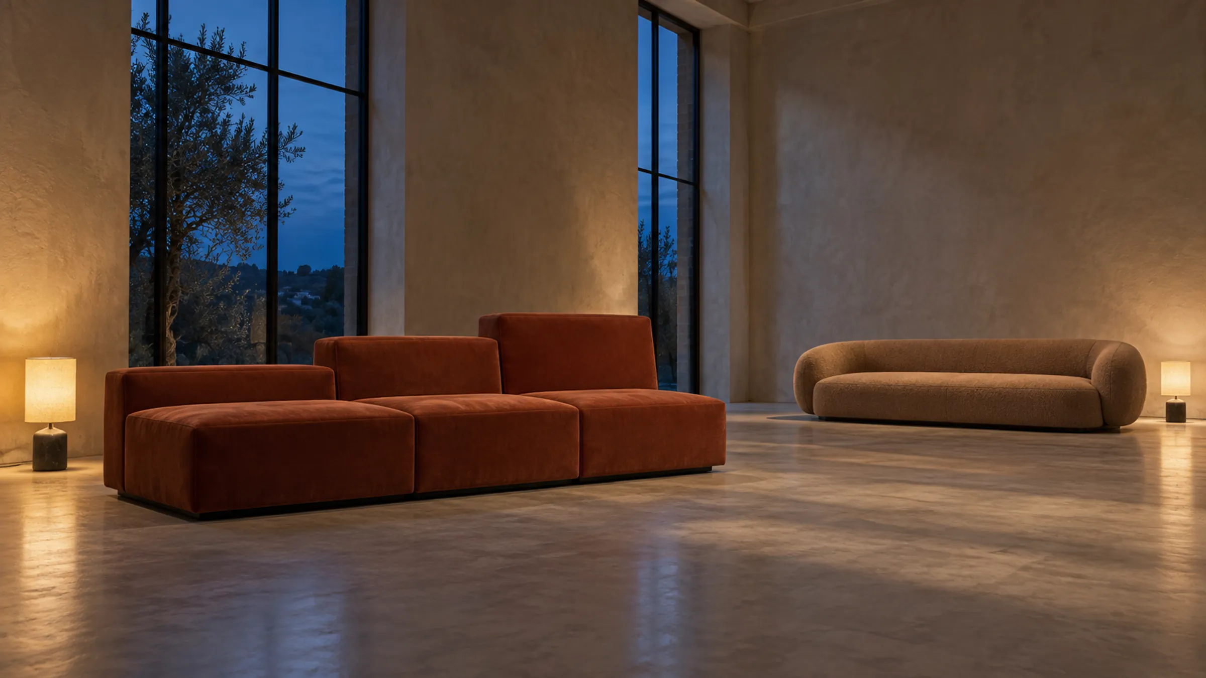 Two sofas in a quiet studio at blue hour