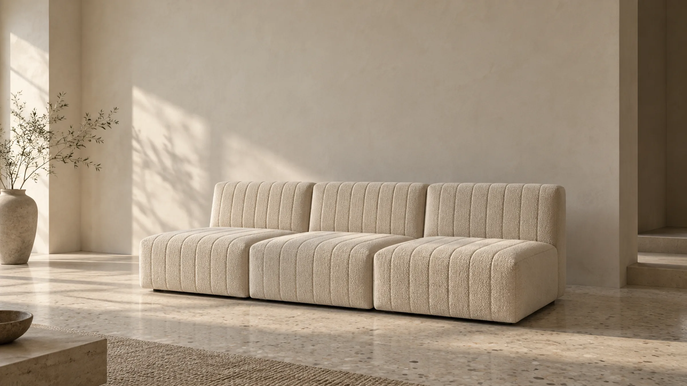 RESTIO: ivory channel-quilted armless modular sofa